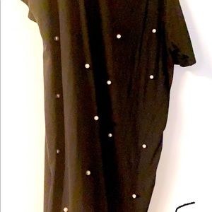 Black dress with white pearls.